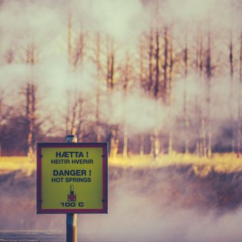 A Danger Hot Springs Sign In Iceland With Steam