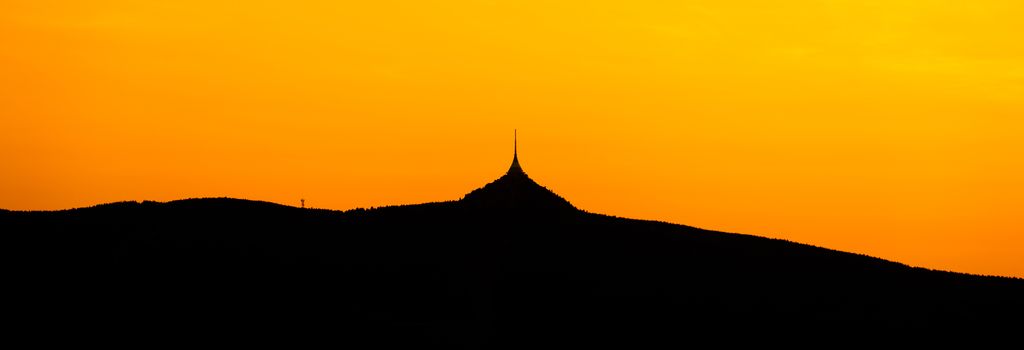Silhouette of Jested mountain at sunset time, Liberec, Czech Republic. Panoramic shot.
