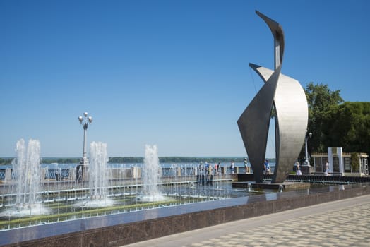 Fountain and sculpture Sail on the Volga river embankment in Samara Russia. On a Sunny summer day. 24 June 2018