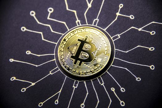 Gold coin Bitcoin lies on the painted chip.