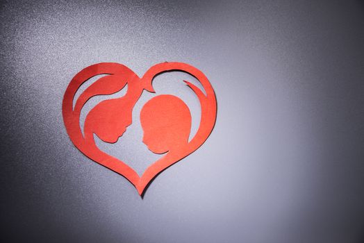mother and child in the form of hearts from paper.