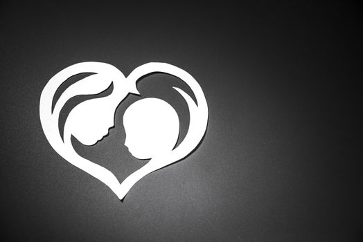mother and child in the form of hearts from paper.