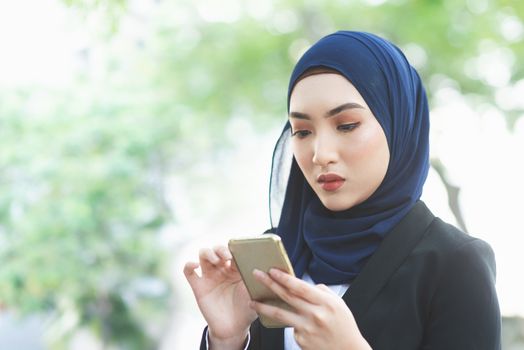 Woman looking at mobile phone with serious face, negative emotion, phishing scams concept.