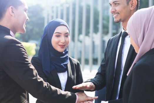 Multiracial business people stacking hands, businessman and businesswoman teamwork concept.