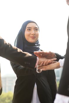 Multiracial business people stacking hands, businessman and businesswoman teamwork concept.