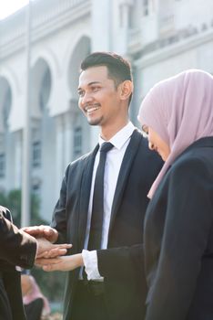 Multiracial business people stacking hands, businessman and businesswoman teamwork concept.