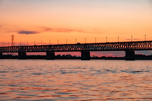 Bridge over the Amur river at sunset. Russia. Khabarovsk. Photo from the middle of the river