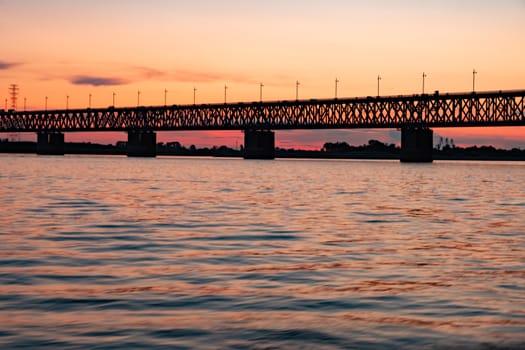 Bridge over the Amur river at sunset. Russia. Khabarovsk. Photo from the middle of the river