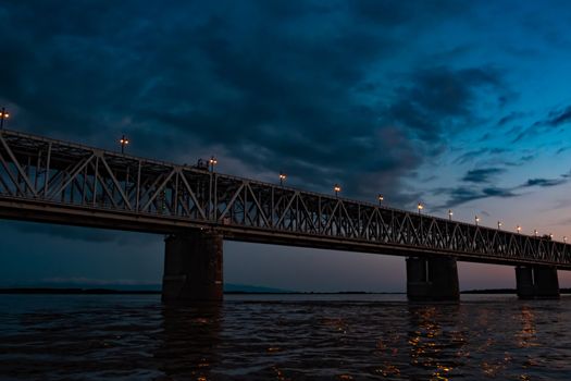 Bridge over the Amur river at sunset. Russia. Khabarovsk. Photo from the middle of the river