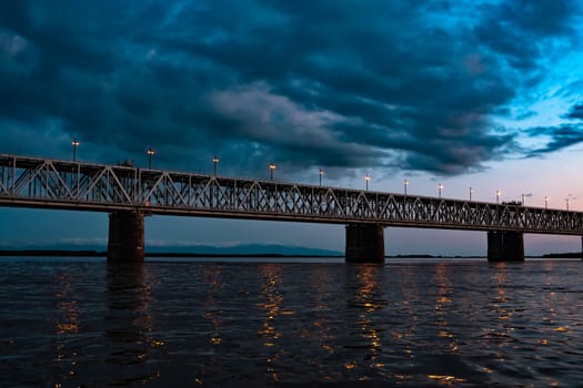 Bridge over the Amur river at sunset. Russia. Khabarovsk. Photo from the middle of the river