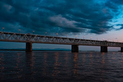 Bridge over the Amur river at sunset. Russia. Khabarovsk. Photo from the middle of the river