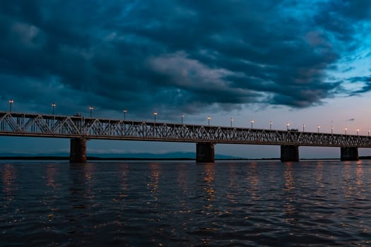 Bridge over the Amur river at sunset. Russia. Khabarovsk. Photo from the middle of the river