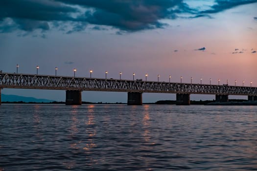 Bridge over the Amur river at sunset. Russia. Khabarovsk. Photo from the middle of the river