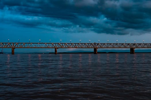 Bridge over the Amur river at sunset. Russia. Khabarovsk. Photo from the middle of the river