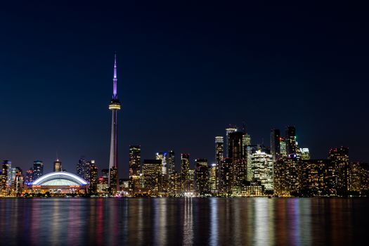 Night View of Downtown Toronto from Toronto Islands with the Lake Ontario, Canada.