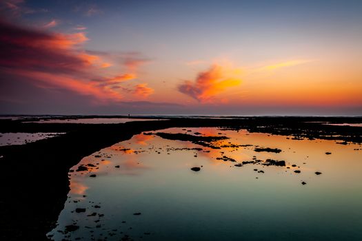 Sunset on the beach of the Corrales, fish pens, of Rota, Cadiz, Spain