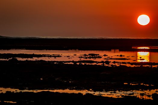 Sunset on the beach of the Corrales, fish pens, of Rota, Cadiz, Spain