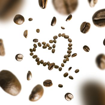 Coffee beans in the shape of a heart in flight on a white background,