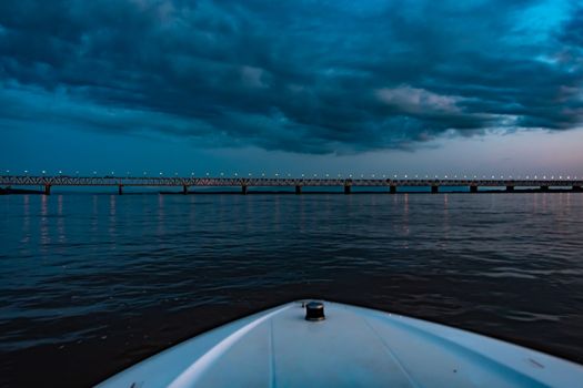 Bridge over the Amur river at sunset. Russia. Khabarovsk. Photo from the middle of the river