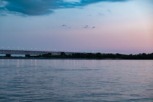 Bridge over the Amur river at sunset. Russia. Khabarovsk. Photo from the middle of the river