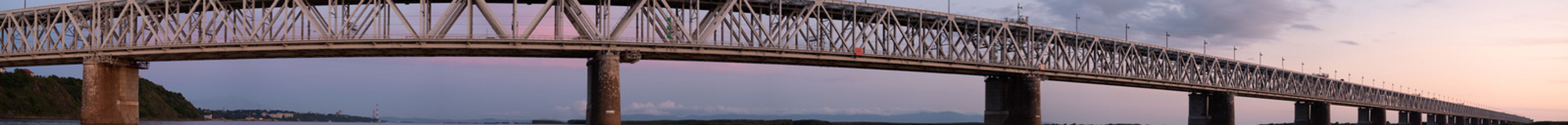 Bridge over the Amur river at sunset. Russia. Khabarovsk. Photo from the middle of the river