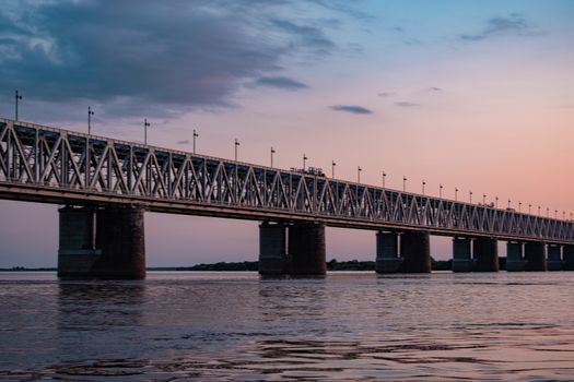 Bridge over the Amur river at sunset. Russia. Khabarovsk. Photo from the middle of the river