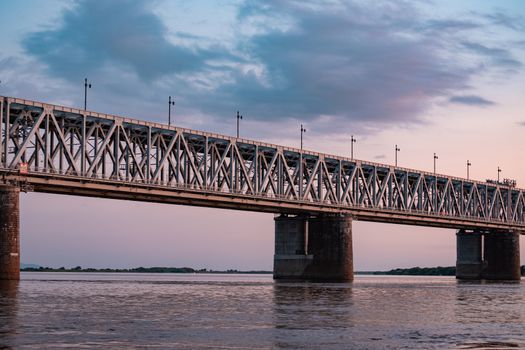 Bridge over the Amur river at sunset. Russia. Khabarovsk. Photo from the middle of the river