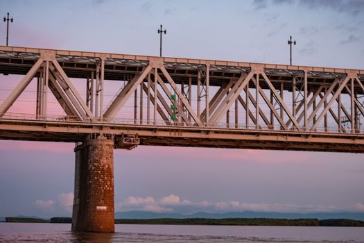 Bridge over the Amur river at sunset. Russia. Khabarovsk. Photo from the middle of the river