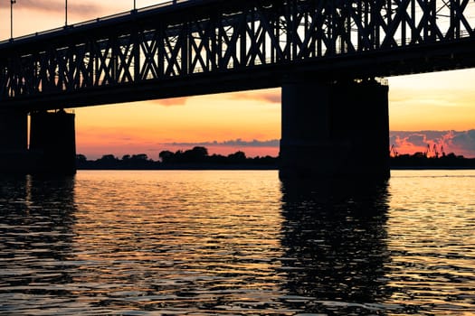 Bridge over the Amur river at sunset. Russia. Khabarovsk. Photo from the middle of the river