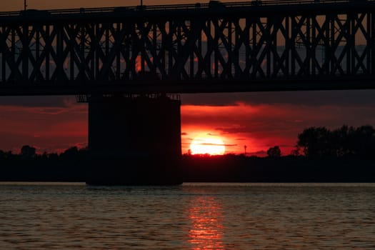 Bridge over the Amur river at sunset. Russia. Khabarovsk. Photo from the middle of the river