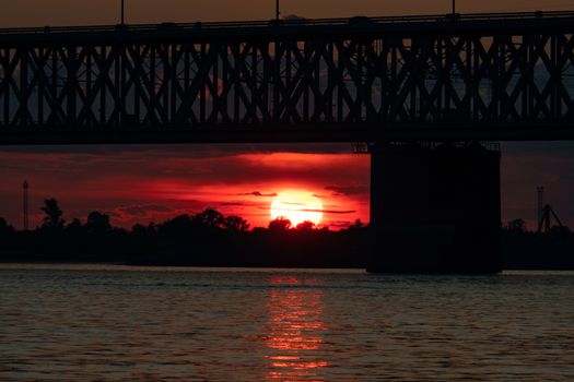 Bridge over the Amur river at sunset. Russia. Khabarovsk. Photo from the middle of the river