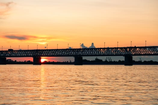 Bridge over the Amur river at sunset. Russia. Khabarovsk. Photo from the middle of the river