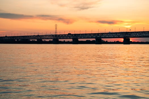 Bridge over the Amur river at sunset. Russia. Khabarovsk. Photo from the middle of the river