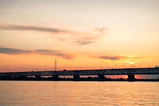 Bridge over the Amur river at sunset. Russia. Khabarovsk. Photo from the middle of the river