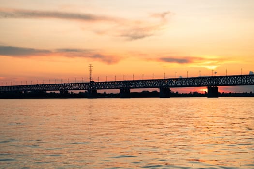 Bridge over the Amur river at sunset. Russia. Khabarovsk. Photo from the middle of the river