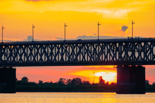 Bridge over the Amur river at sunset. Russia. Khabarovsk. Photo from the middle of the river