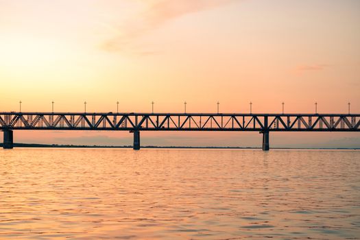 Bridge over the Amur river at sunset. Russia. Khabarovsk. Photo from the middle of the river