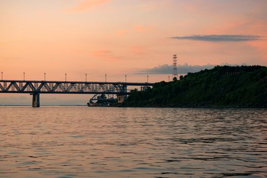 Bridge over the Amur river at sunset. Russia. Khabarovsk. Photo from the middle of the river