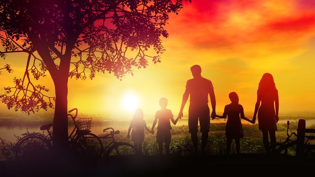 Against the background of a hot summer sunset, there are silhouettes of a family of five and bicycles lie nearby.