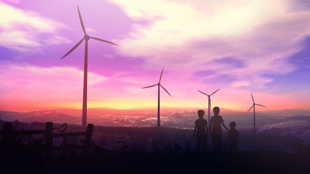 Silhouettes of children standing against the sun at sunset opposite windmill power plants.