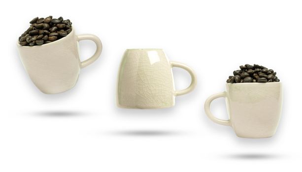 Coffee bean in white ceramic cup. Isolate and clipping path on white background.