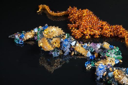 Different jewelries on a glass studio background