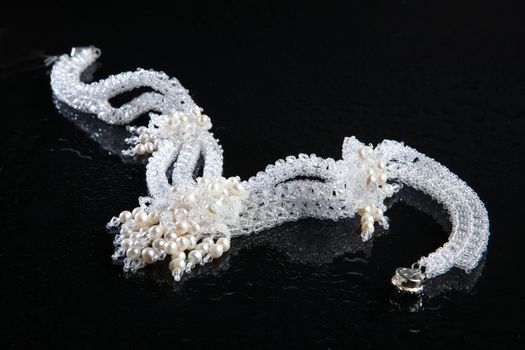 Different jewelries on a glass studio background