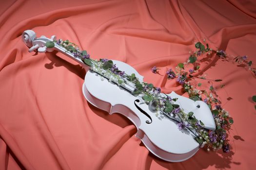 White decorative violin and flower composition