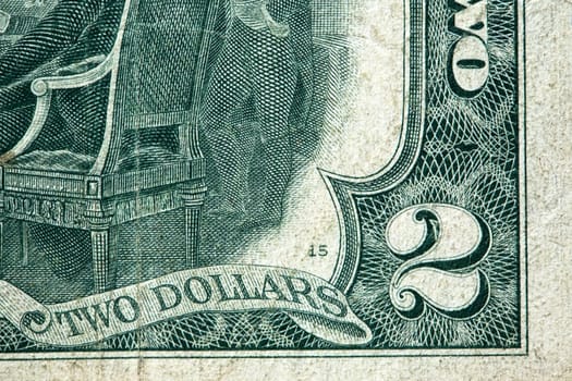 Fragment of old two USA dollar banknote extreme closeup