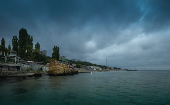 Odessa, Ukraine - 09.09.2018. Otrada beach in Odessa, Ukraine, in a gloomy summer morning. Dark clouds asperatus over the sea until dawn.