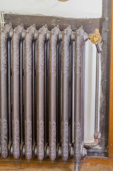 An antique vintage radiator of a central heating system