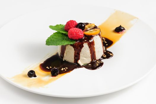 semifredo, italian ice cream dessert with halva, raspberry and chocolate sauce on top