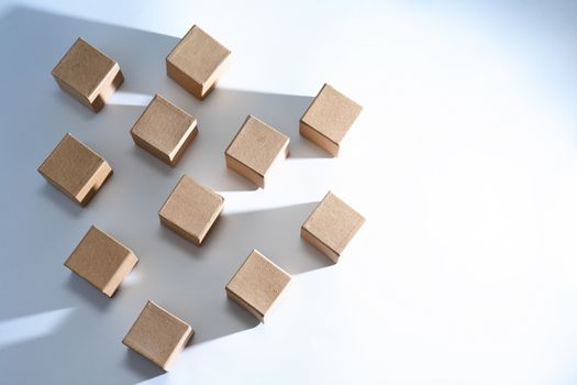 Set of cardboard cubes on white background with light and shadows