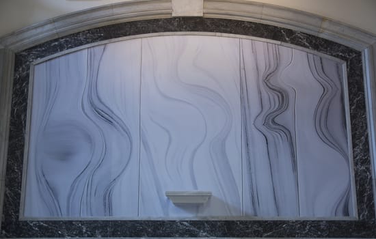 Marble wall plate with curved lines. The design is very beautiful